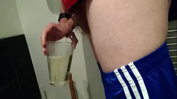 Filling a glass with my piss and cum and drinking the whole lot